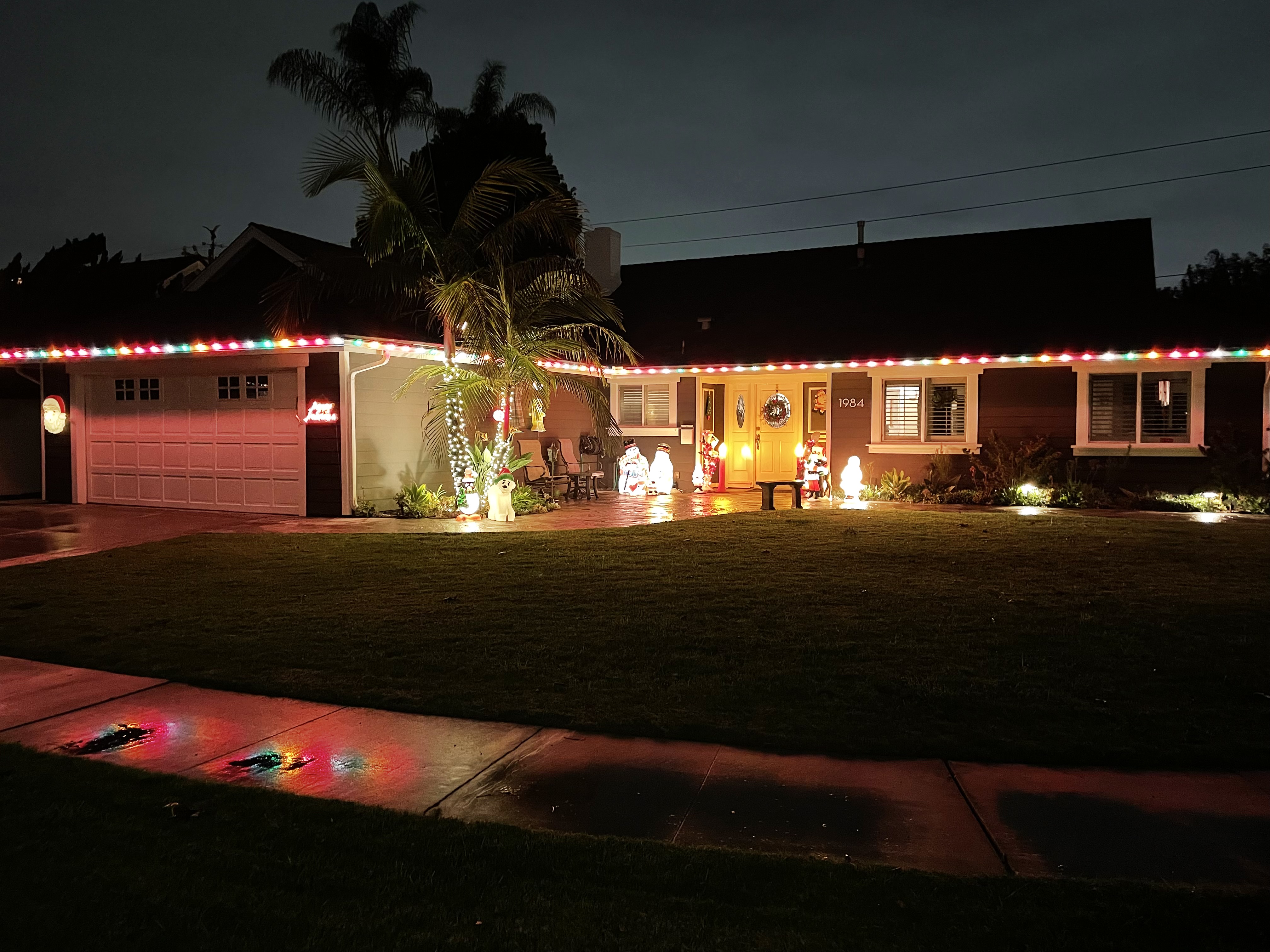 Colorful Christmas lights along a home's roofline